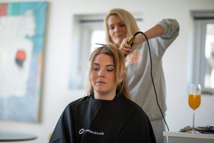 Curling Women Hair with a Flat Iron