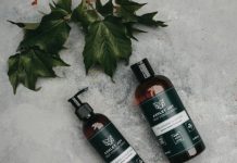 Natural volumizing shampoo and conditioner with green leaves for organic hair care.